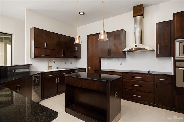 kitchen featuring wall chimney range hood, sink, dark brown cabinets, black appliances, and a kitchen island