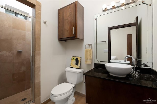 bathroom with walk in shower, toilet, and sink