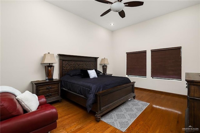 bedroom with hardwood / wood-style flooring and ceiling fan