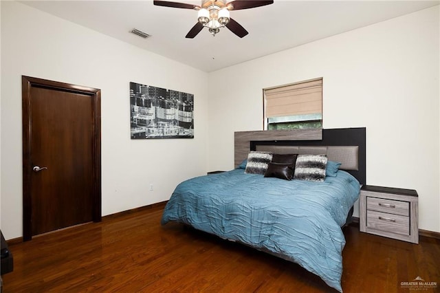 bedroom featuring dark wood-type flooring and ceiling fan