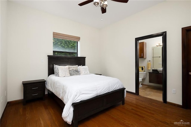 bedroom with dark wood-type flooring, ceiling fan, and ensuite bathroom