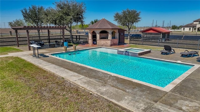 view of swimming pool featuring a patio area, fence, a pool with connected hot tub, and a pergola