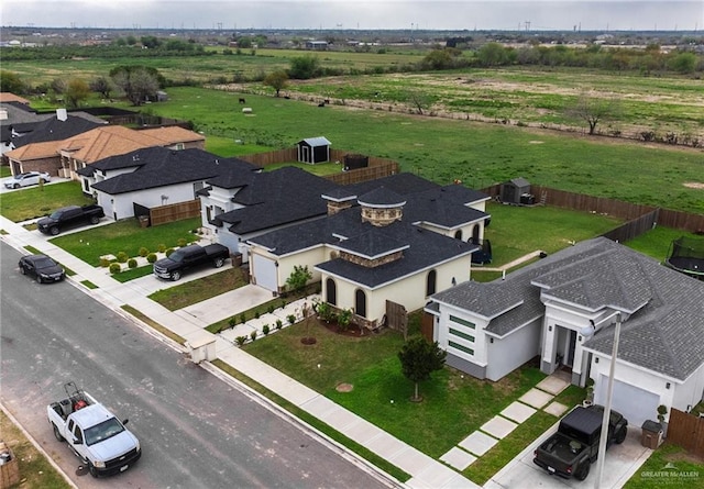 birds eye view of property featuring a rural view