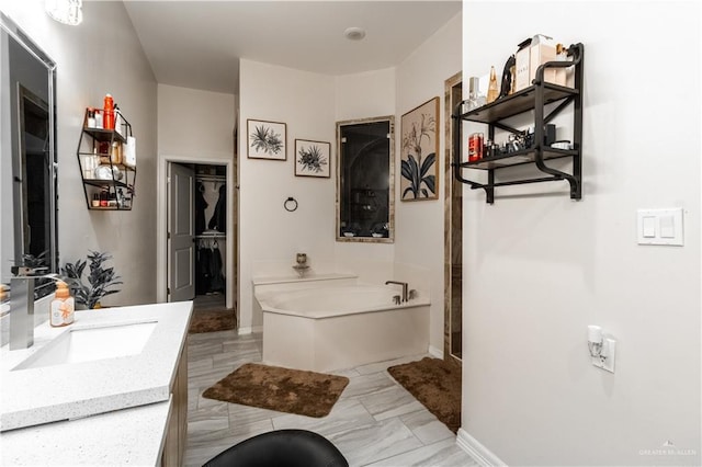 bathroom featuring a bathing tub and vanity