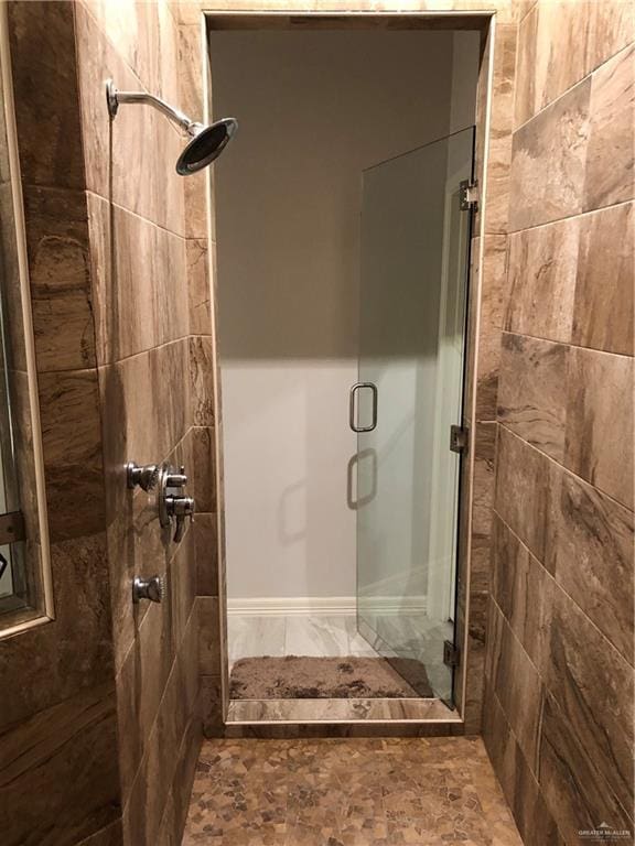 bathroom featuring an enclosed shower