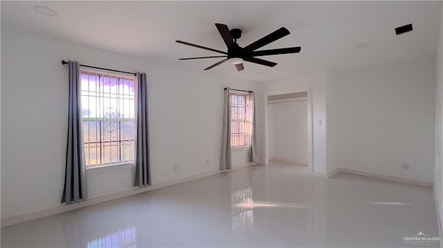 empty room featuring ceiling fan