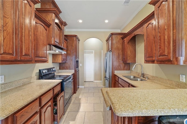 5212 N Huisache St, Pharr, TX 78577 - kitchen featuring arched walkways, black range with electric stovetop, a sink, freestanding refrigerator, and ornamental molding
