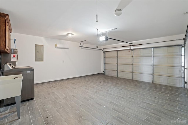 5212 N Huisache St, Pharr, TX 78577 - garage featuring independent washer and dryer, a sink, water heater, baseboards, and electric panel