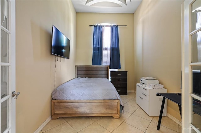 5212 N Huisache St, Pharr, TX 78577 - bedroom with baseboards and light tile patterned floors