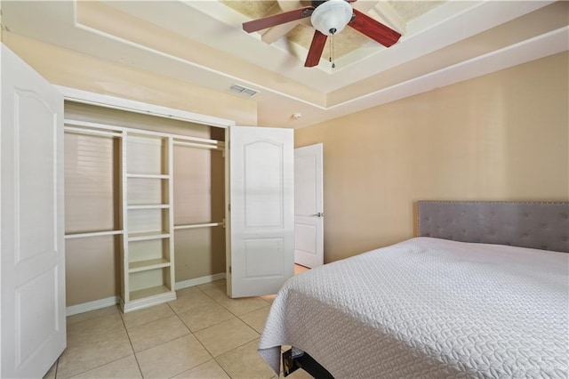 5212 N Huisache St, Pharr, TX 78577 - bedroom with ceiling fan, a raised ceiling, baseboards, light tile patterned floors, and visible vents