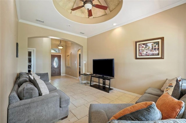 5212 N Huisache St, Pharr, TX 78577 - tiled living room with arched walkways, a ceiling fan, baseboards, visible vents, and ornamental molding
