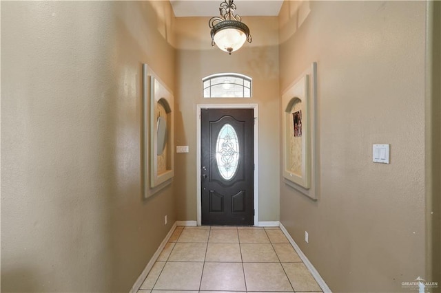 5212 N Huisache St, Pharr, TX 78577 - foyer entrance with baseboards, a towering ceiling, and light tile patterned floors
