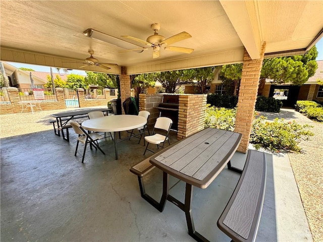 view of patio / terrace with outdoor dining space, fence, and ceiling fan