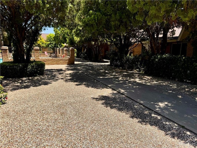 view of street with concrete driveway