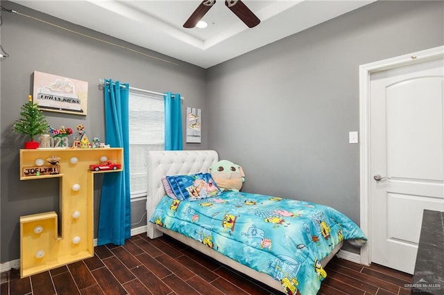 bedroom featuring ceiling fan and dark hardwood / wood-style floors