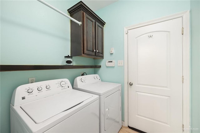 597 Greystone Cir, Alamo, TX 78516 - laundry area with washer and dryer and cabinet space