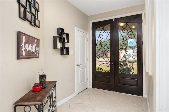 tiled foyer entrance featuring french doors