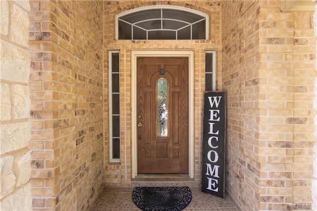 907 Amethyst Dr, Weslaco, TX 78596 - doorway to property featuring brick siding
