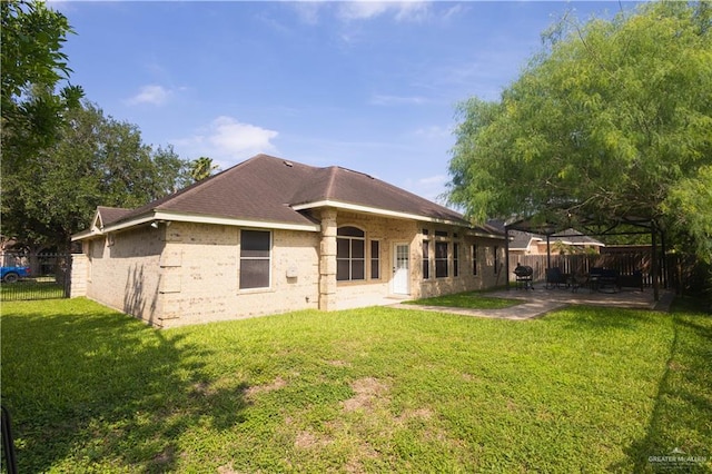 907 Amethyst Dr, Weslaco, TX 78596 - rear view of property featuring a patio area and brick siding