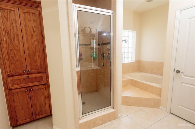 907 Amethyst Dr, Weslaco, TX 78596 - bathroom with tile patterned flooring, a shower stall, and a bath