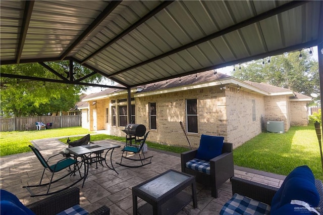 907 Amethyst Dr, Weslaco, TX 78596 - view of patio / terrace featuring central air condition unit, outdoor dining space, and area for grilling