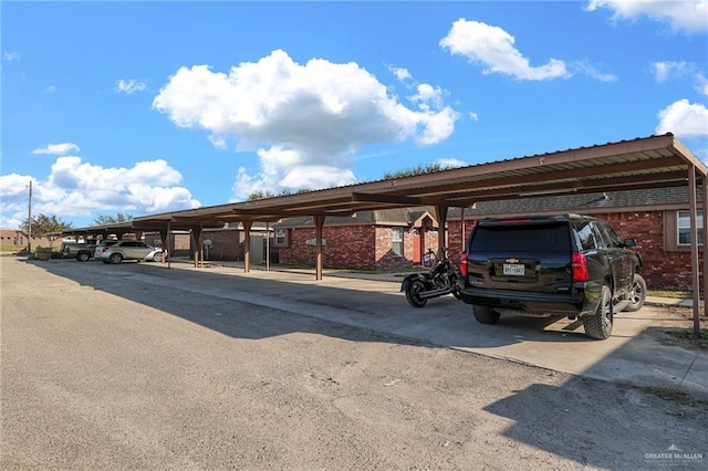 view of parking / parking lot featuring a carport