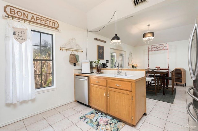 kitchen with a peninsula, a sink, visible vents, light countertops, and dishwasher