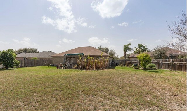 view of yard featuring a fenced backyard