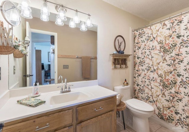 full bath featuring toilet, curtained shower, tile patterned flooring, a textured ceiling, and vanity