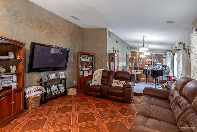 living area featuring a chandelier