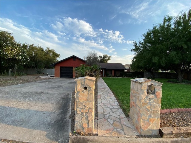 ranch-style house featuring driveway and a garage