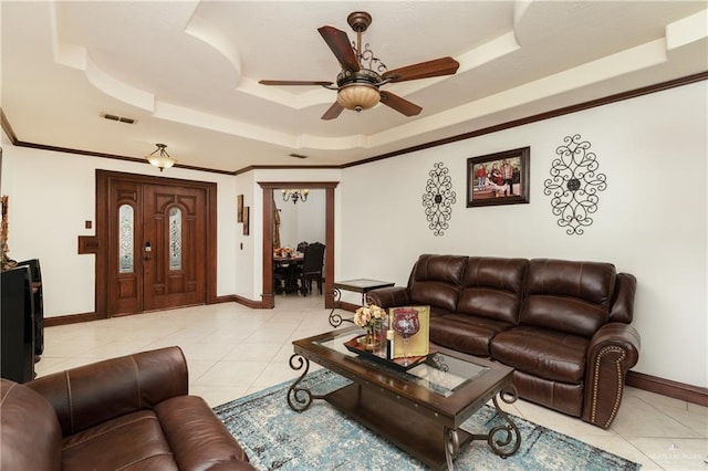 living room featuring light tile patterned floors, a raised ceiling, and ceiling fan