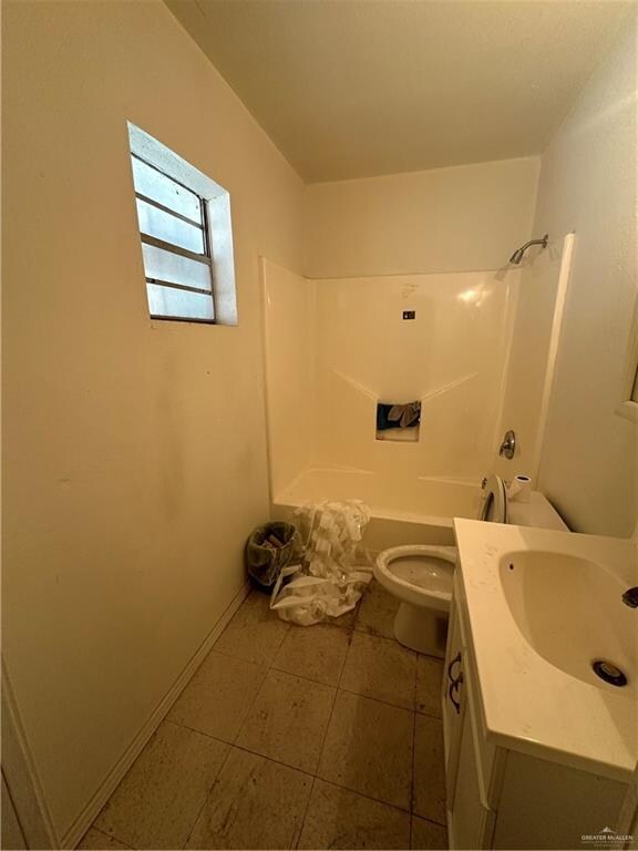 full bathroom featuring tile patterned floors, vanity, toilet, and shower / bathtub combination