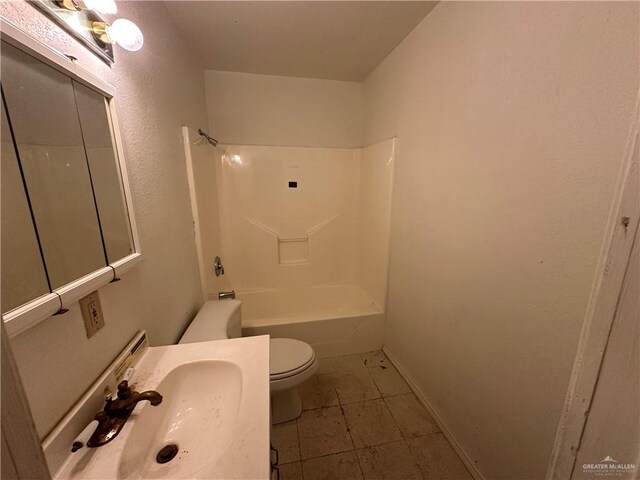 full bathroom featuring tile patterned floors, shower / bath combination, toilet, and sink