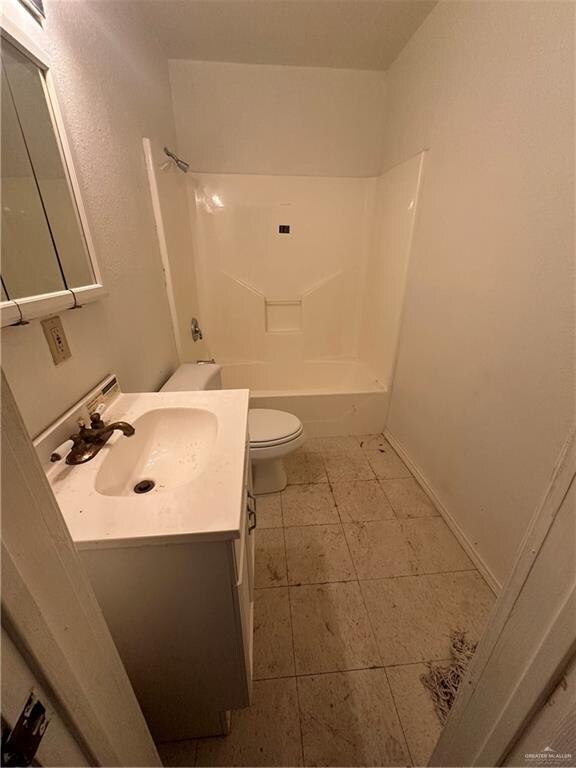 full bathroom featuring tile patterned flooring, vanity, toilet, and shower / washtub combination