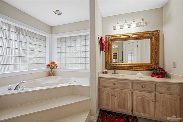 bathroom featuring vanity and a tub to relax in