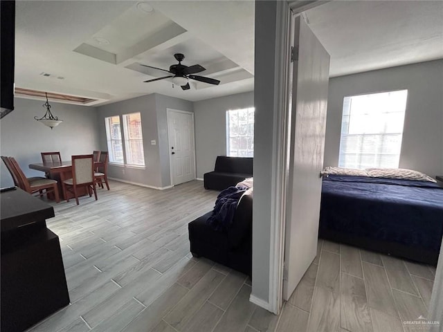 living room featuring a wealth of natural light, wood finish floors, and baseboards