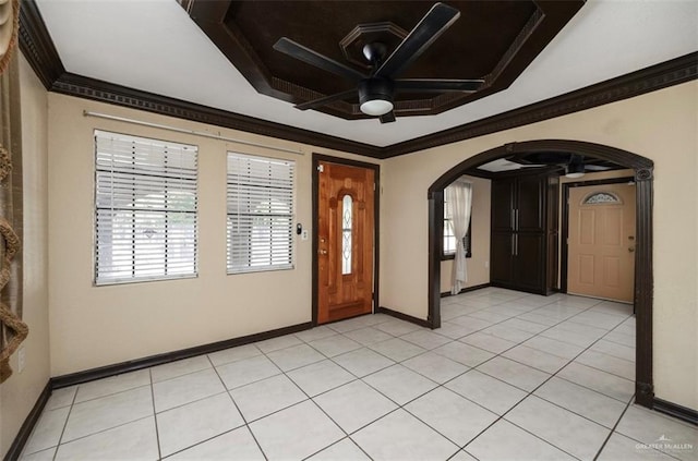 foyer featuring light tile patterned floors, ceiling fan, and ornamental molding