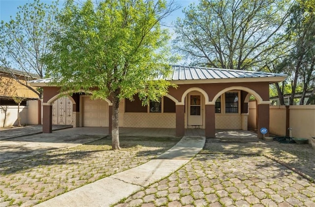 view of front of home with a garage and covered porch