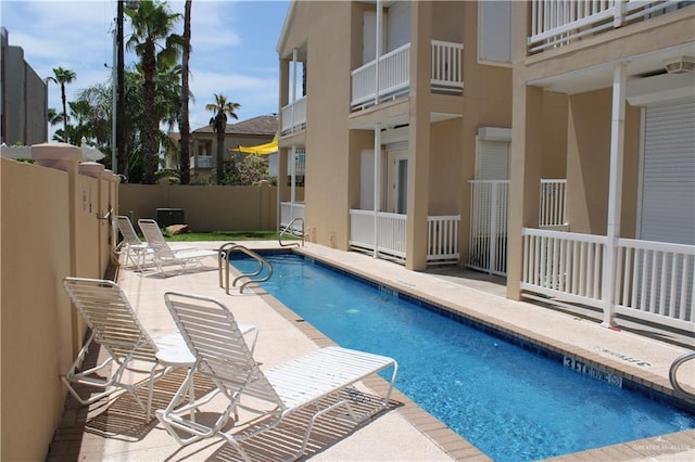 131 E Saturn Ln Unit 3, South Padre Island, TX 78597 - community pool featuring a patio area