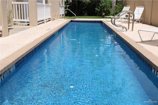 131 E Saturn Ln Unit 3, South Padre Island, TX 78597 - outdoor pool with a patio