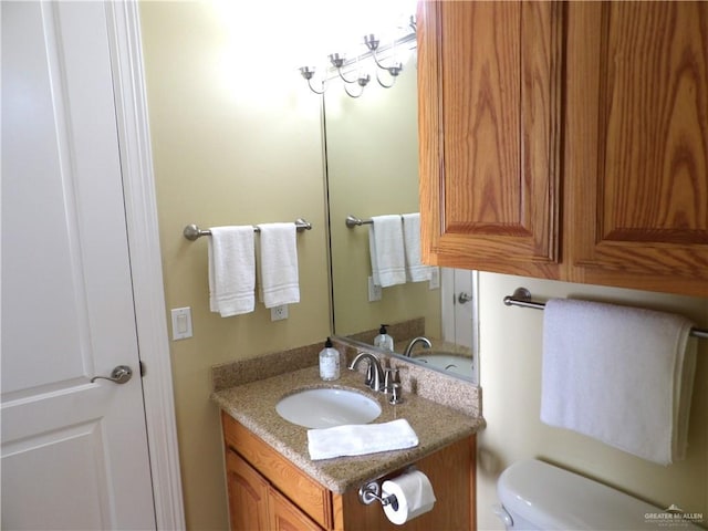 131 E Saturn Ln Unit 3, South Padre Island, TX 78597 - half bathroom featuring vanity and toilet