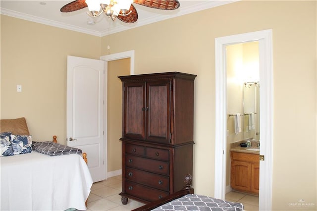 131 E Saturn Ln Unit 3, South Padre Island, TX 78597 - bedroom featuring light tile patterned floors, ornamental molding, ensuite bathroom, a ceiling fan, and a sink