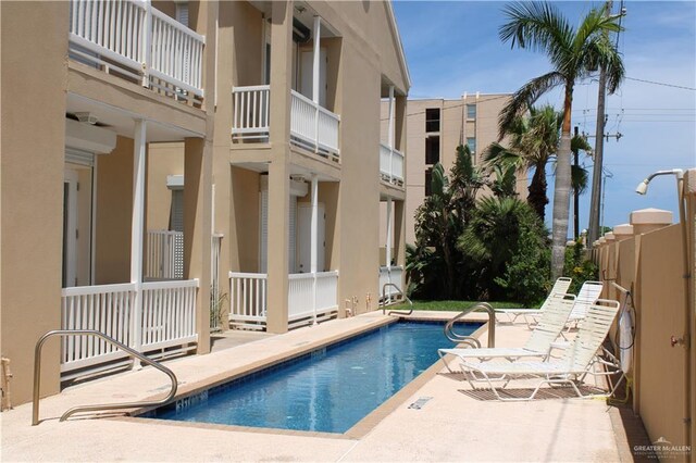131 E Saturn Ln Unit 3, South Padre Island, TX 78597 - community pool with a patio