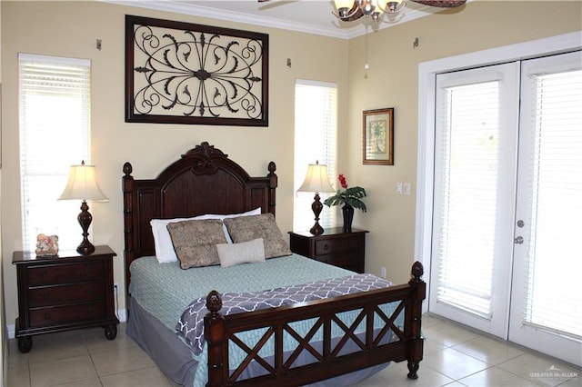 131 E Saturn Ln Unit 3, South Padre Island, TX 78597 - bedroom featuring light tile patterned floors, access to outside, multiple windows, and crown molding