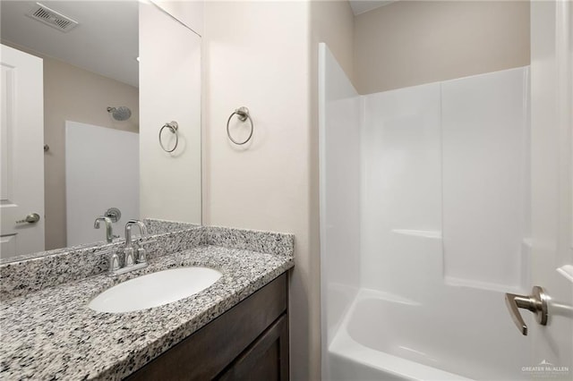 bathroom with vanity and shower / bath combination