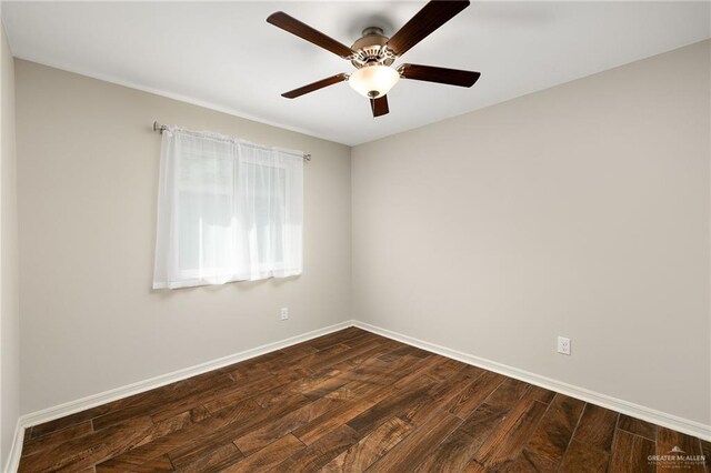 unfurnished room featuring dark wood-type flooring and ceiling fan