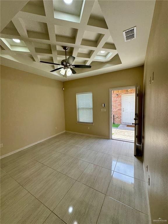 unfurnished room with beam ceiling, coffered ceiling, a ceiling fan, visible vents, and baseboards