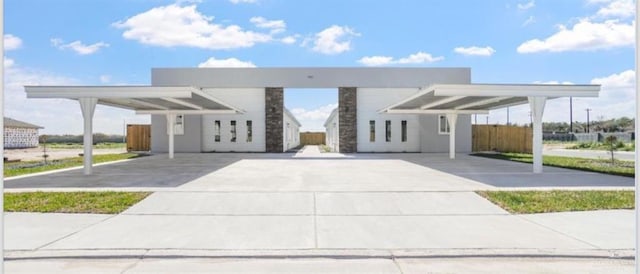 view of front of home featuring a carport