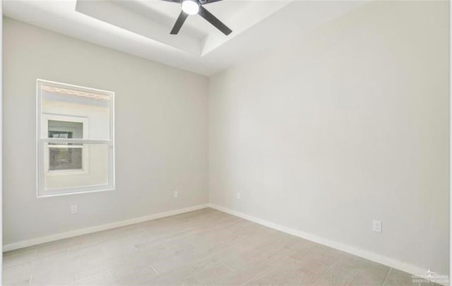 empty room featuring ceiling fan and light hardwood / wood-style flooring